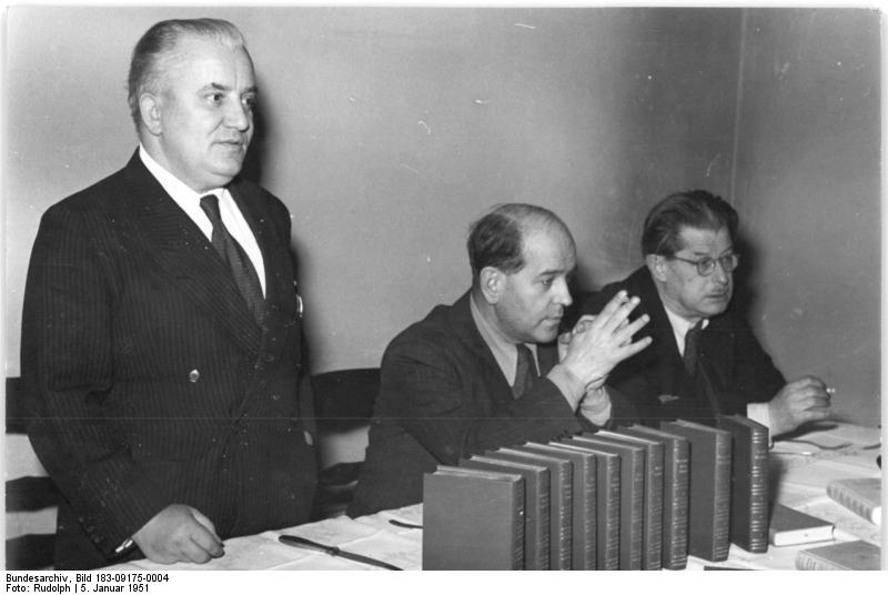 Book series of progressive writers appear. The first ten volumes of the library of advanced writers, published after the Cultural Regulation of the GDR of 16 March 1950, now appear. On this occasion, a press conference was held on 5 January 51 in Kulturbundhaus in Berlin. Shown here: Willi Bredel (left) next to Prof. Wieland Herzfelde. In the foreground, the series of books bound in leather. Right: W. Langrock, head of the Department of the Polygraphic Industry in the GDR.