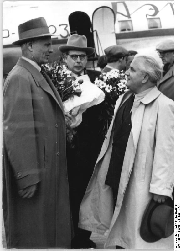 At the Schoenefeld airport, 21 May 1952 more guests arrive to participate in the 3rd German Writers' Congress. Shown here: Winner of the National Prize, Willi Bredel welcomes the Soviet poet Stepan Stschipatschew (left) and Professor Myasnikov. 